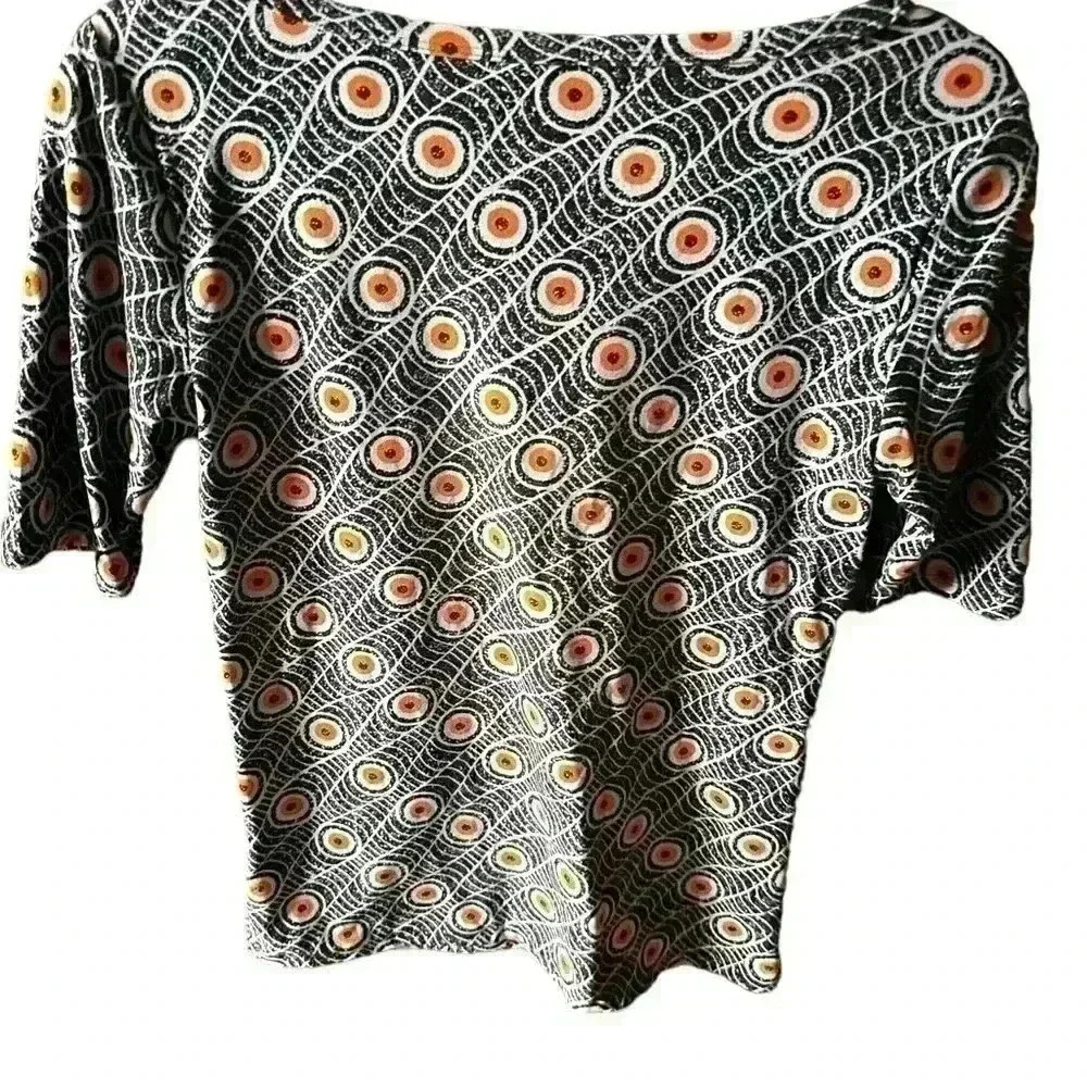 Lularoe small Gigi top . Light blue, orange, black. Legging material. Eyeballs!